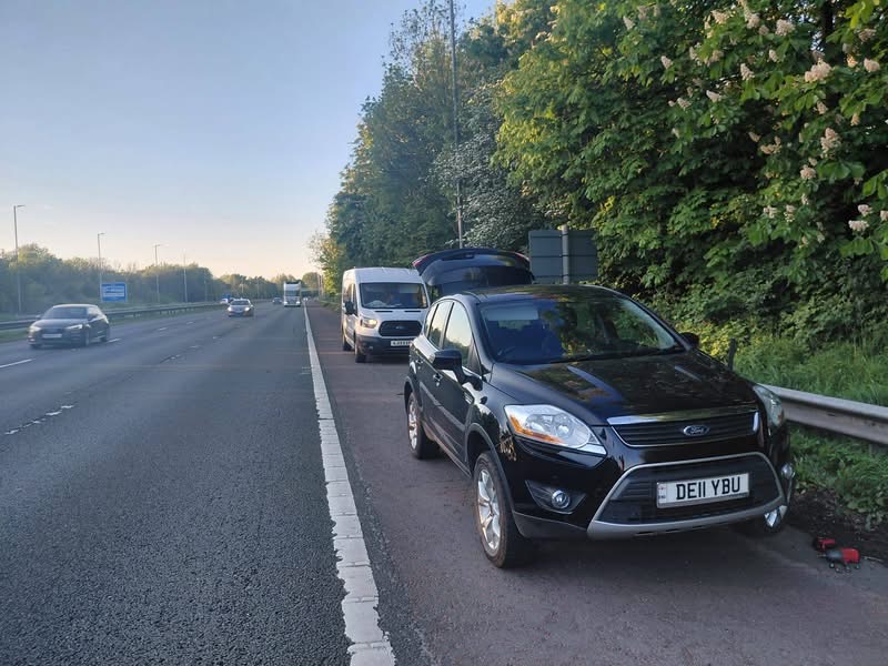 Motorway hard shoulder tyre rescue at dawn — Elite Mobile Tyre Service van assisting a Ford Kuga on the M62 hard shoulder in Yorkshire