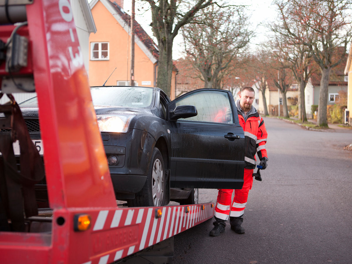 A car being recovered at the roadside.