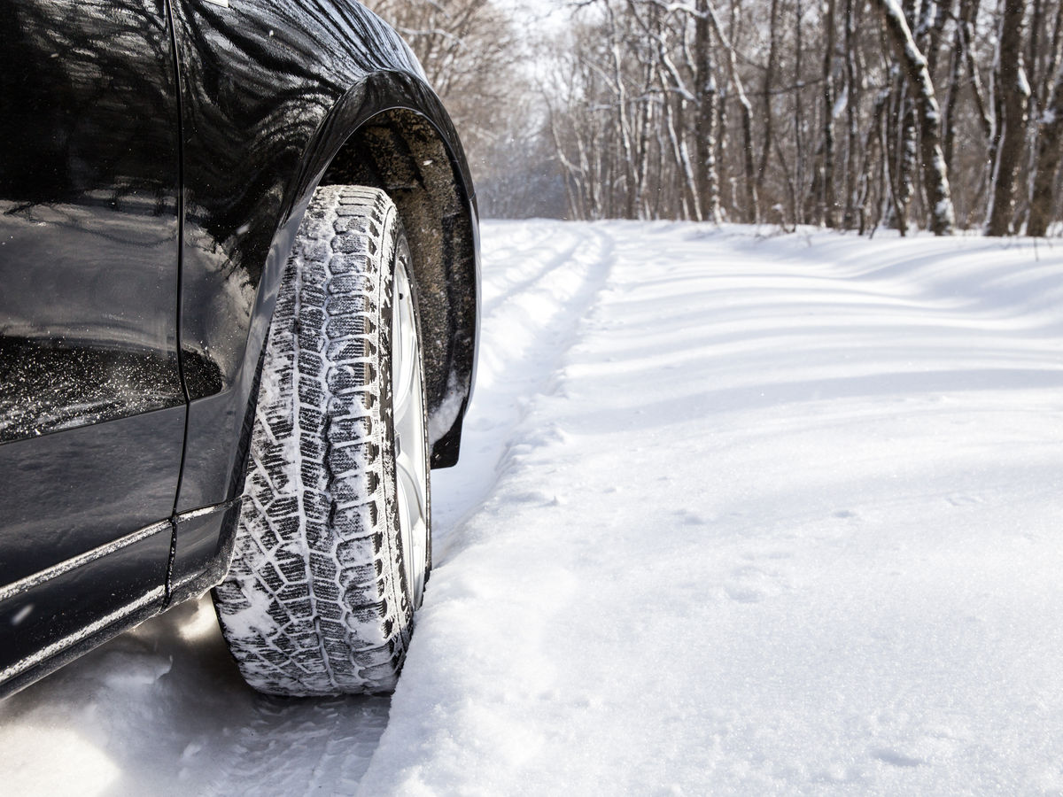 SUV driving in winter conditions.